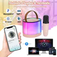 Altavoz portátil de Karaoke Klack con un micrófono
